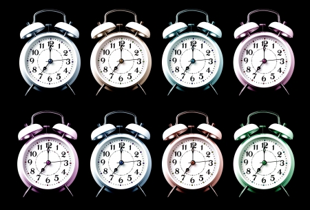 old style alarm clocks on black backgroundの写真素材