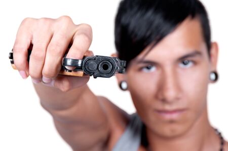 Hispanic man Pointing Gun at Camera Gangster Style selective focusの写真素材