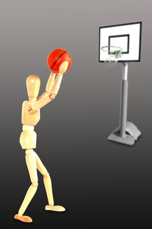 Wooden Dummy Basketball player throwing the ball の写真素材