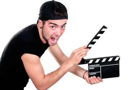 A smiling man holding a movie clap isolated on white background の写真素材