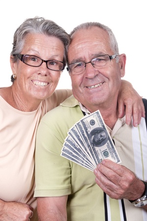 happy elderly couple holding bills の写真素材