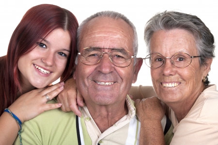 Grandparents and their granddaughter on white backgroundの写真素材