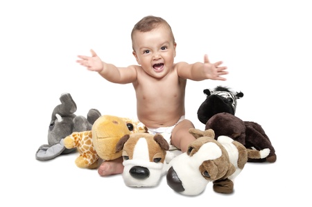 A baby boy in the middle of alot of stuffed animals. の写真素材