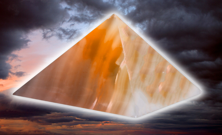 ston pyramide on stormy skyの写真素材