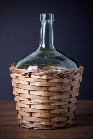 vintage jug with wicker coverの写真素材