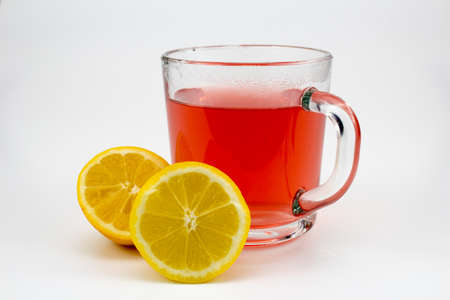 a cup of fruit tea with lemonsの写真素材