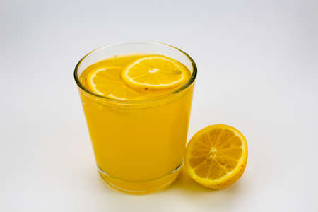 cold orange juice with lemon sliceの写真素材