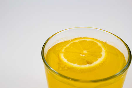 cold orange juice with lemon sliceの写真素材