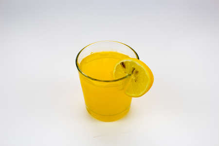 cold orange juice with lemon sliceの写真素材