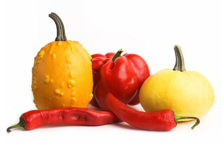 Red and yellow vegetables - little pumpkins, sweet pepper, chili pepper.の写真素材