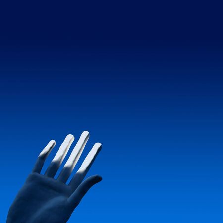 White hand of a statue in the bright blue sky.の写真素材