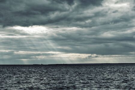 Cold north sea, sky covered with clouds.の写真素材