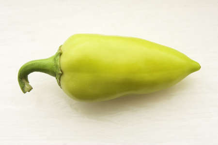 Sweet yellow paprica (Capsicum frutescens) on an old table.の写真素材
