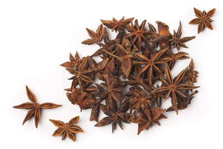 Stack of anise stars isolated on white.の写真素材