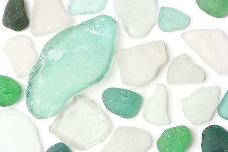 White and green glass sea wasted stones isolated on white.