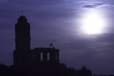 Old church ruins in the night under moonlight.の写真素材
