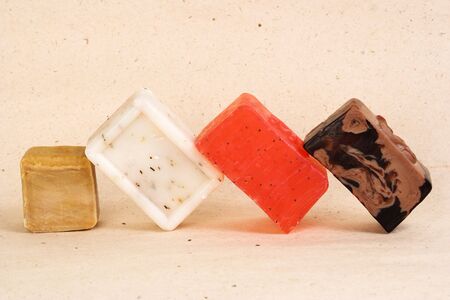 Bars of different colored handmade soap with herbs.の写真素材