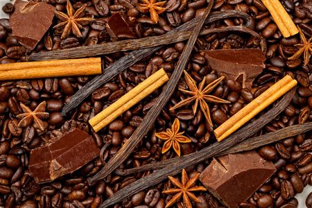 Coffee, chocolate, cinnamon sticks, vanilla beans and star anise.の写真素材