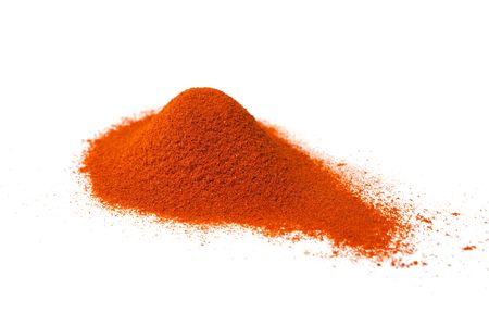 Heap of ground paprika isolated on white.の写真素材