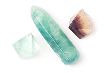 Fluorite crystals and stick - used in magical healing, isolated on white.の写真素材