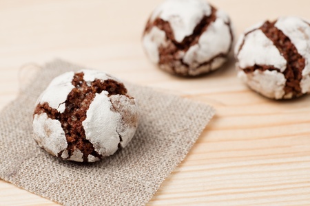 One chocolate crinkle on a piece of linen and two aside.の写真素材