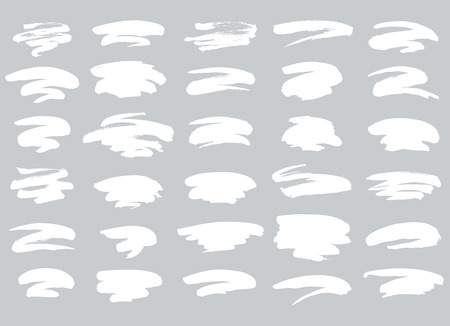 Collection of miscellaneous artistic grunge brush strokes in white isolated over light grey background. Set of design elements. Vector illustration.のイラスト素材