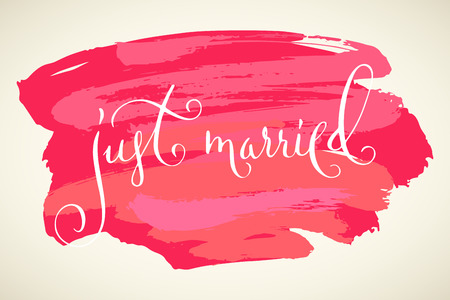 Just married. Wedding words. Hand written vector design element in white over pink and red brush strokes background. Traditional calligraphy.のイラスト素材