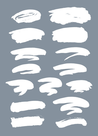 Collection of miscellaneous grunge brush strokes in white isolated over light grey background. Set of design elements. Vector illustration.のイラスト素材
