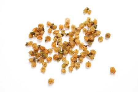 Dried mistletoe berries used for medicinal purposes and also to make magic potions, isolated over white background.の写真素材