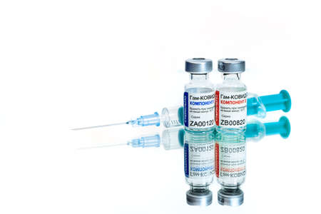 MOSCOW, RUSSIA - February 9, 2021: New Russian vaccine Sputnik V with a syringe isolated on white background.のeditorial素材