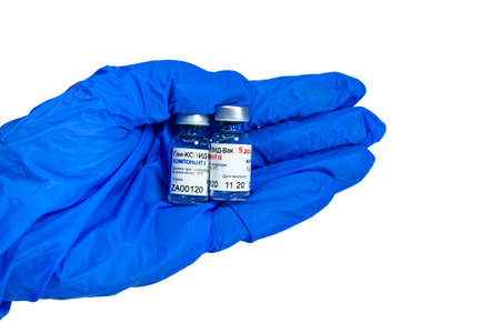 MOSCOW, RUSSIA - February 9, 2021: New Russian vaccine Sputnik V in blue glove hand isolated on...