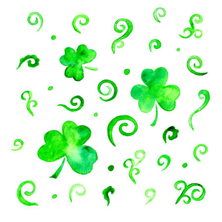 Hand drawn watercolor Saint Patrick's Day trefoil shamrock leaves and swirls. Irish festival celebration greeting card design elements. Celtic interlaced art in green isolated over white.の写真素材