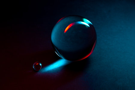 A captivating arrangement of glass spheres reflecting vibrant colorful lights, showing elegance and...