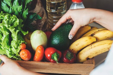 upper view photo of a box full and vegetables fruits bought for quarantine hoardingの写真素材