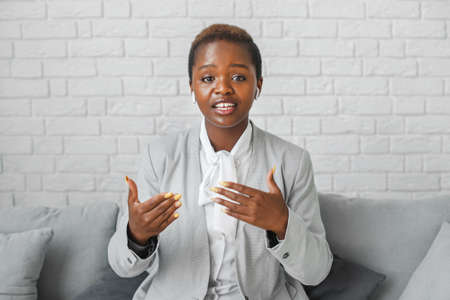 Woman having meeting online and explain business things. Online conference, distance communication.
