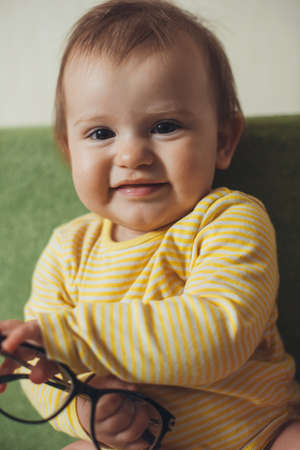 Beautiful expressive smiling baby infant face. Caucasian ethnicity.の写真素材