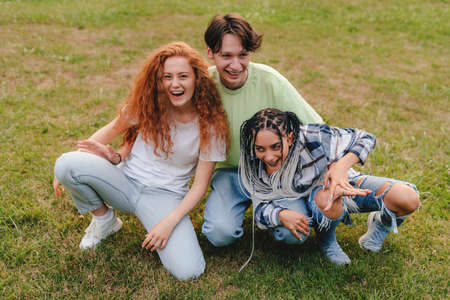 A modern Gen-Z influencer taking a photo to post on  social networks. Working as an influencerの写真素材