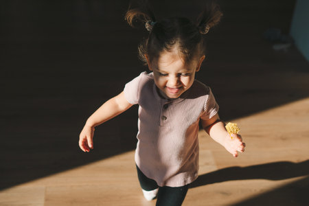 One toddler running and playing at home in the living room, development and learning concept small...