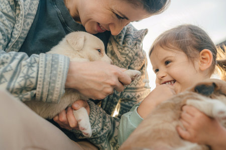 Mother and son hugging dog on bedの写真素材