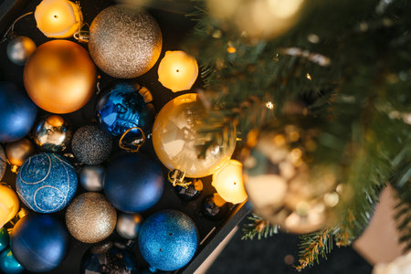 Top view full box with golden and blue balls for the christmas tree. Christmas decoration home. Christmas eve.の写真素材