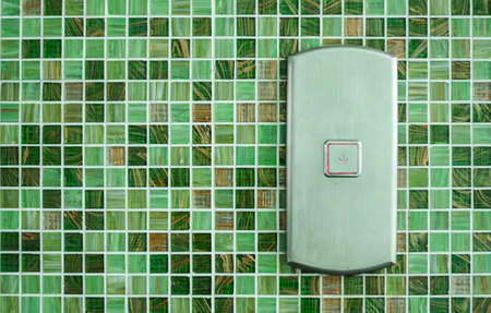 Press the elevator Down and keypad elevator With Green Tile wallの写真素材