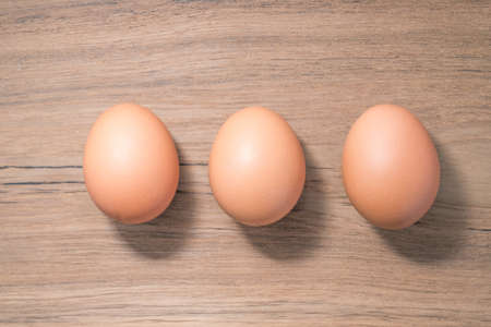 Set of Close up group three of Egg on wooden background, isolated, fresh eggの写真素材