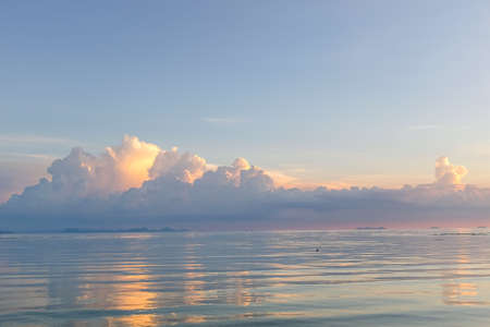 View from ship looking to beautiful cloud on the sky reflection on clear water in the seaの写真素材