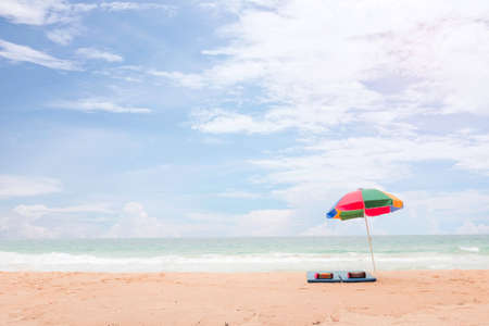 Vacation time at Phuket, Thailand, Mat, and Pillow under the umbrella at the beach. Cloudy backgroundの写真素材