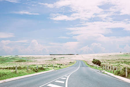 Beautiful scene long destination road through the field on non-urban side with cloudyの写真素材