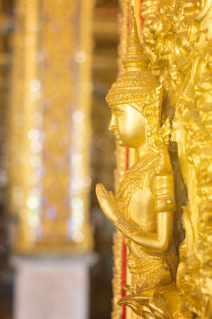 Thai golden statue with beautiful traditional texture.の写真素材