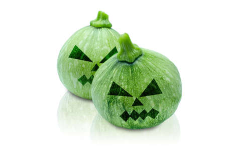 Pumpkins Halloween painted with black. Angry face. Isolated on white background with clipping path.の写真素材