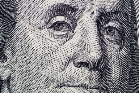 Close up on US dollar banknotes.  Portrait of Franklin on US dollar Banknotes. Shooting by 1:1 Macro lense.の写真素材
