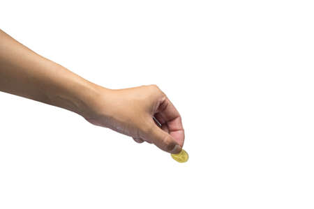 Male hand giving golden coin isolated on white backgroundの写真素材