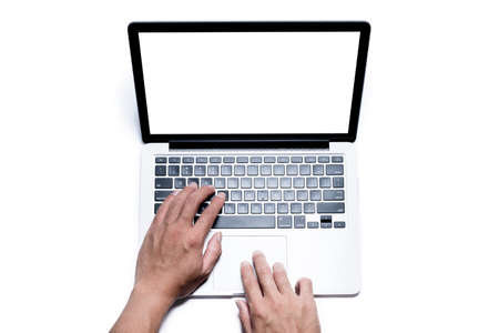 Top view, Male's hand working by using and typing on white laptop with blank white screen. Isolated on white background with clipping path.の写真素材